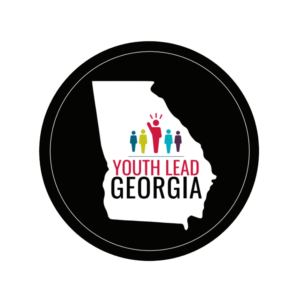 A circle-shaped graphic with the logo for Youth Lead Georgia. The logo is an outline of the state of Georgia with five human-shaped icons and the text "Youth Lead Georgia".